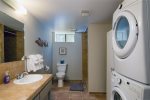 Full bathroom on the lower level, with washer, dryer and walk in shower